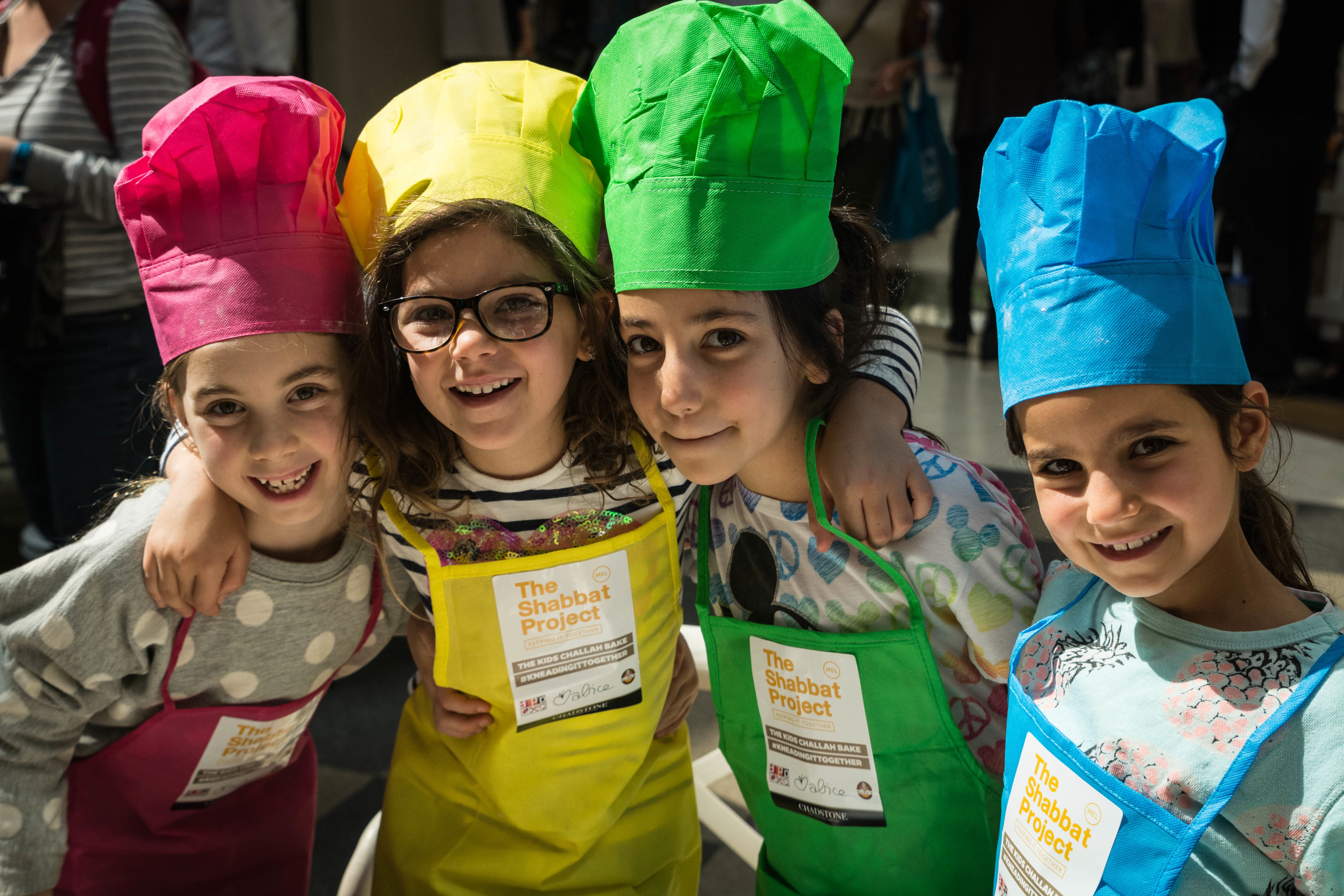 Girls in Melbourne bake challahs during The Shabbat Project (The Shabbat Project)