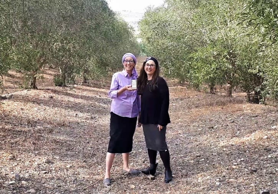 Chana Veffer (left) and Nili Abrahams in the orchards of Degania.