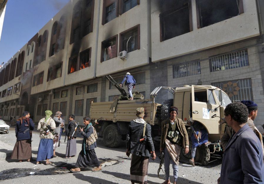 Houthi rebel righters in front of the residence of Yemen's former President Ali Abdullah Saleh