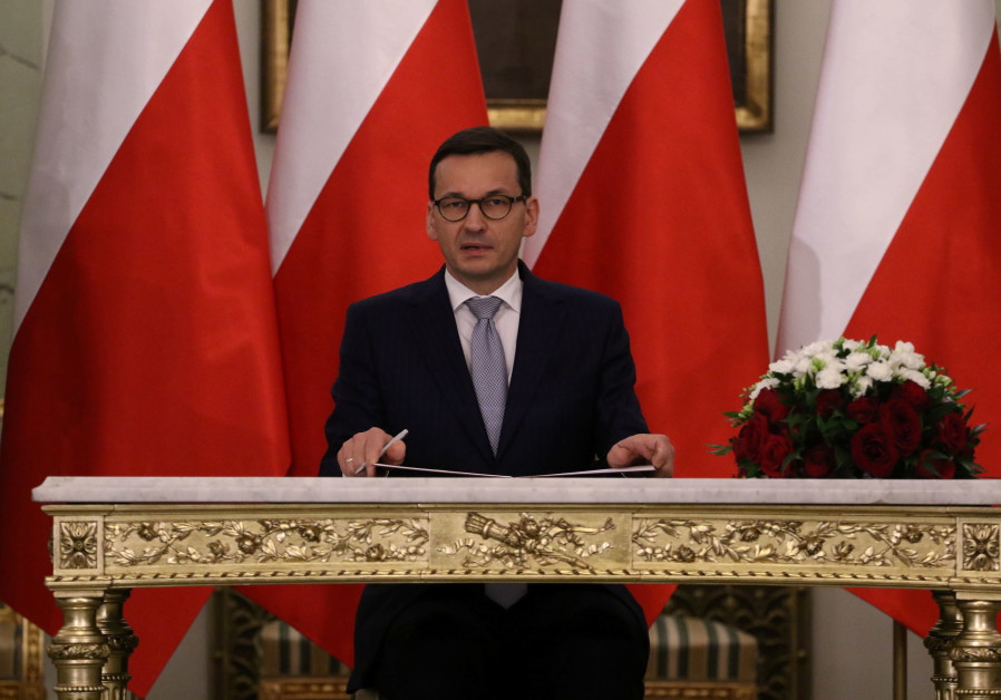 Poland 'caving to Israeli pressure,' freezes Holocaust law