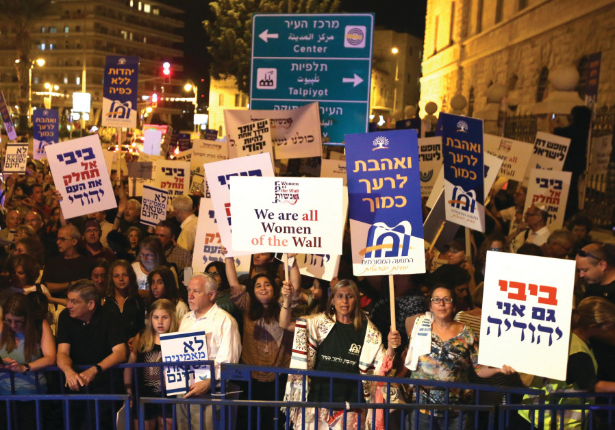 ACTIVISTS TAKE part in a demonstration in Jerusalem in July against legislation that would have stre