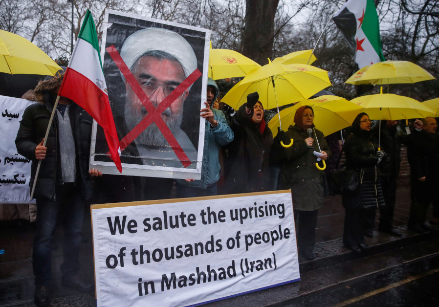 Opponents of Iranian President Hassan Rouhani hold a protest outside the Iranian embassy in west Lon