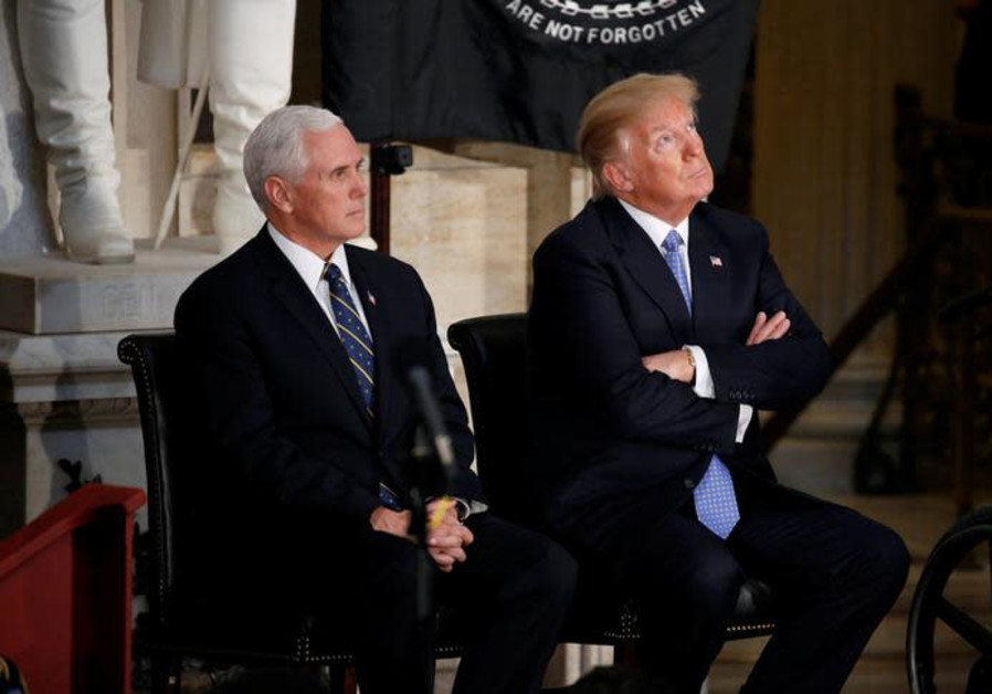 US President Donald Trump looks at the Capitol Rotunda as he sits with US Vice President Mike Pence 