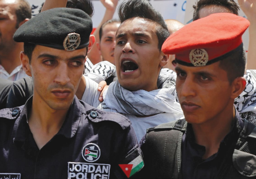 PROTESTERS CHANT slogans during a demonstration near the Israeli Embassy in Amman in July 2017.