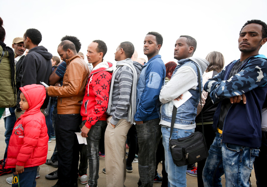 African asylum seekers line up to apply for a visa in Bnei Brak, Israel