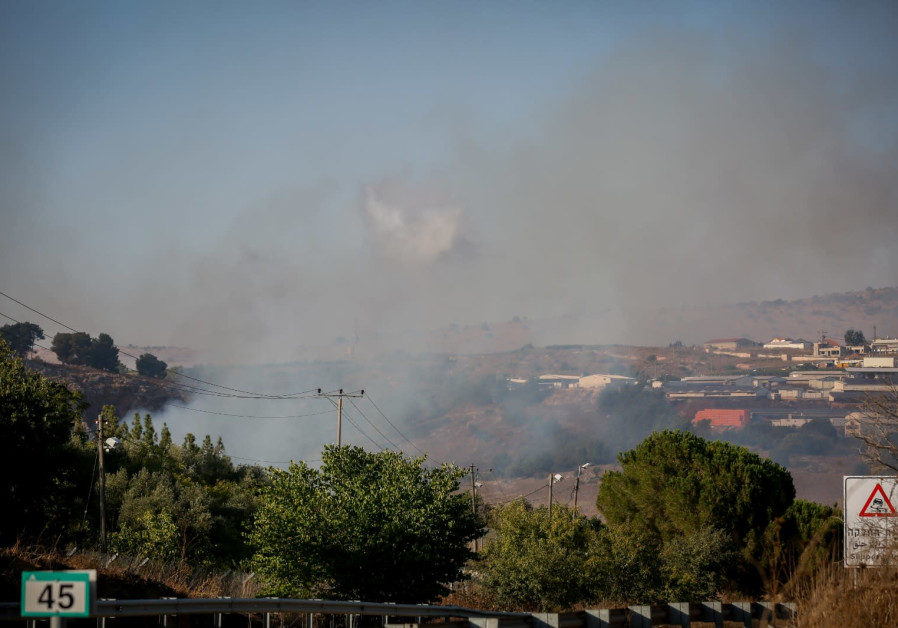 Smoke rises near Moshav Avivim near the border between Israel and Lebanon, in northern Israel, Septe
