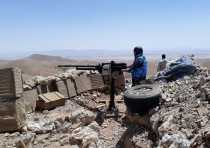 Fighters from the Syrian army units and Hezbollah are seen on the western mountains of Qalamoun, nea