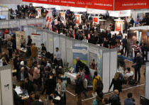 People visit the second job fair for migrants and refugees in Berlin, Germany.