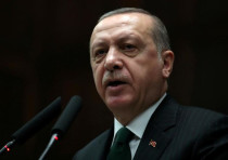 Turkish President Tayyip Erdogan addresses members of parliament from his ruling AK Party (AKP) duri