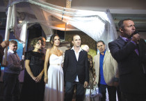 A couple stands underneath a ‘huppa’ during their secular wedding ceremony in Tel Aviv.
