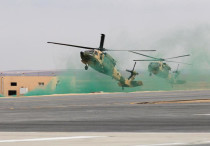 Jordanian army members participate in a hostage rescue drill with Black Hawk helicopters.