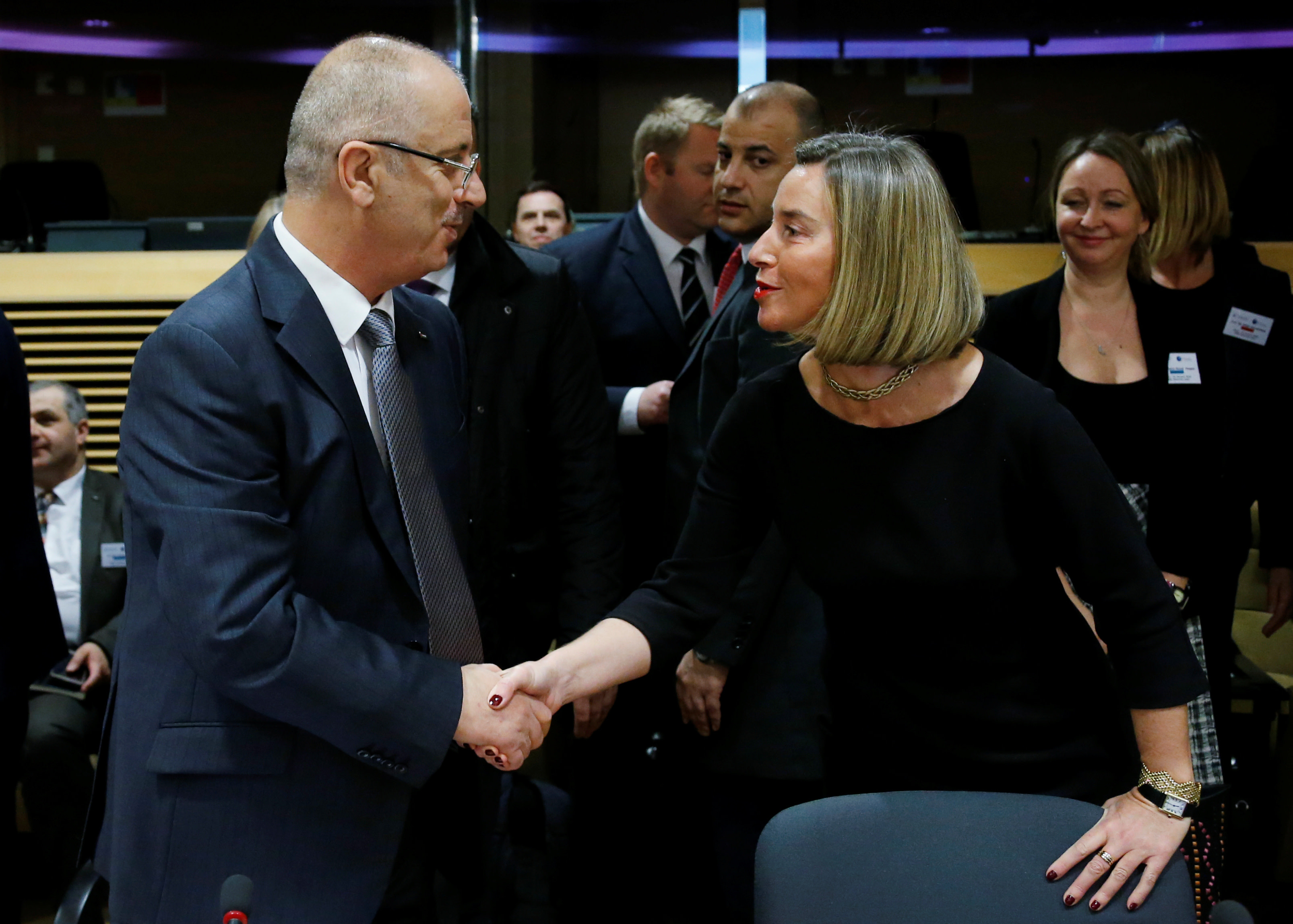 Palestinian Prime Minister Rami Hamdallah shakes hands with European Union's foreign policy chief Federica Mogherini at the EU Commission headquarters in Brussels, Belgium, January 31, 2018. (Reuters)