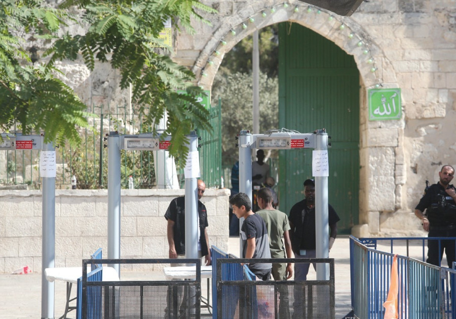 BOYS PASS THROUGH metal detectors just inside the Old City’s Lions’ Gate.