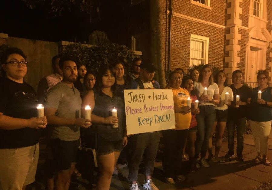 Protesters hold a candlelit vigil at the home of Ivanka Trump and Jared Kushner