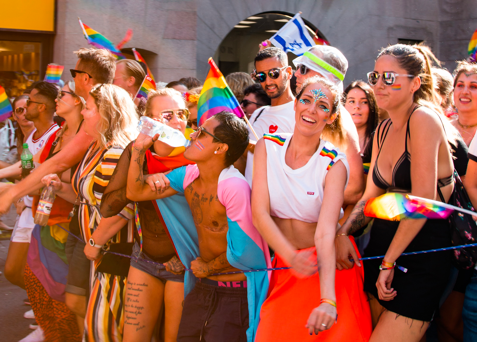 LGBTQ youth at Pride Parade with Israeli flag (Credit: Photo Via pexels - Aleks Magnusson)