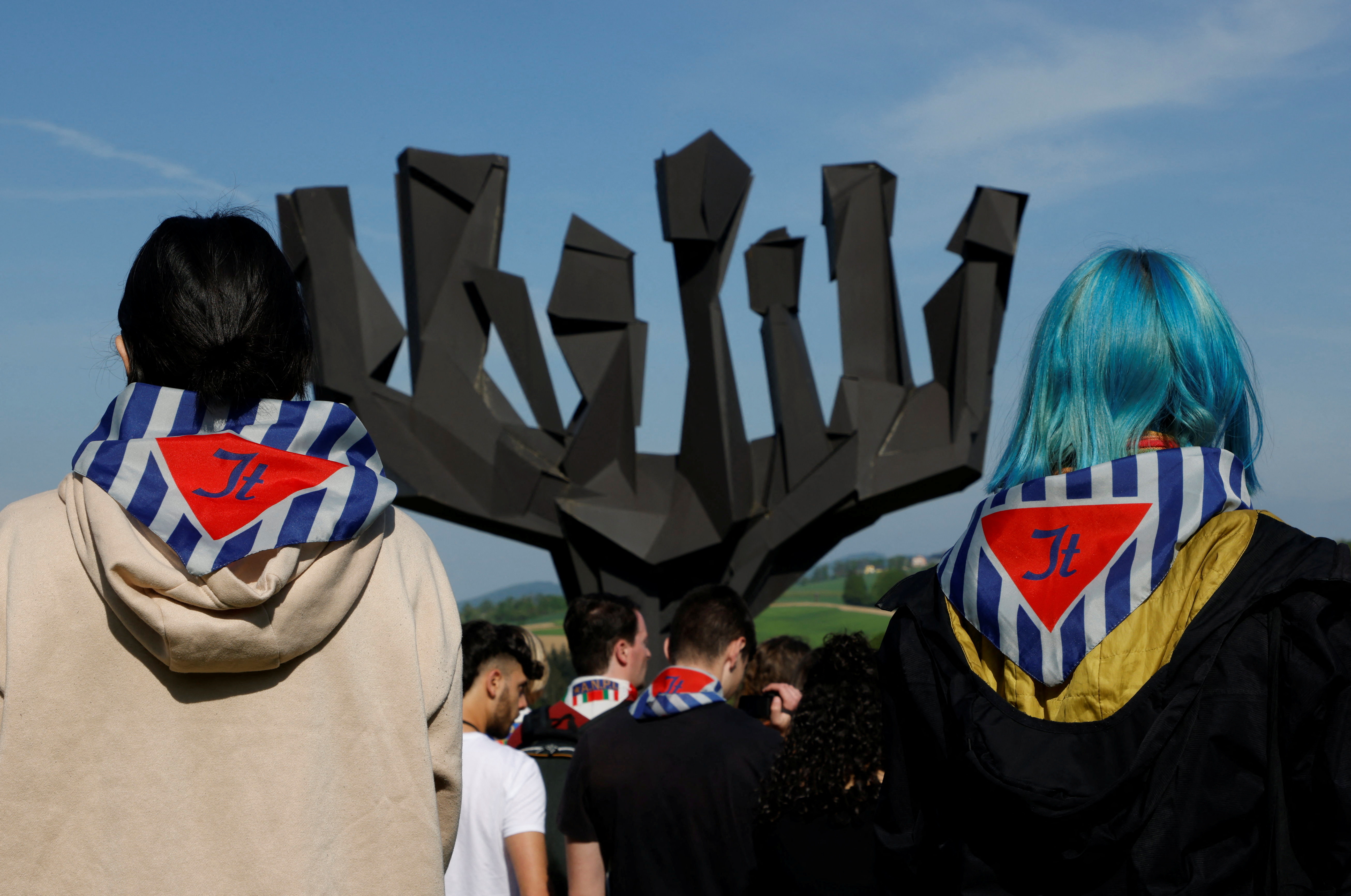People participate in a commemoration of the liberation of the former concentration camp KZ Mauthausen, at the memorial site in Mauthausen, Austria, May 7, 2023. REUTERS/Leonhard Foeger