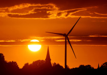 A power-generating windmill turbine is pictured during sunset at a renewable energy park in Ecoust-S