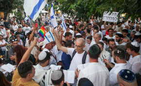  Jews pray while activists protest against gender segregation in the public space during a public prayer on Dizengoff Square in Tel Aviv, on Yom Kippur, the Day of Atonement, and the holiest of Jewish holidays, September 25, 2023.