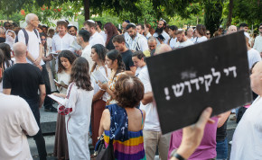  Jews pray while activists protest against gender segregation in the public space during a public prayer on Dizengoff Square in Tel Aviv, on Yom Kippur, the Day of Atonement, and the holiest of Jewish holidays, September 25, 2023. 