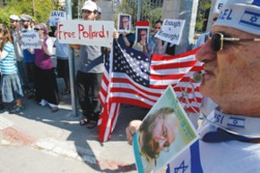 Pollard supporters stand outside US Justice Dept.
