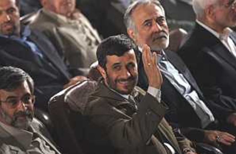 ahmadinejad smiles waves (photo credit: AP [file])