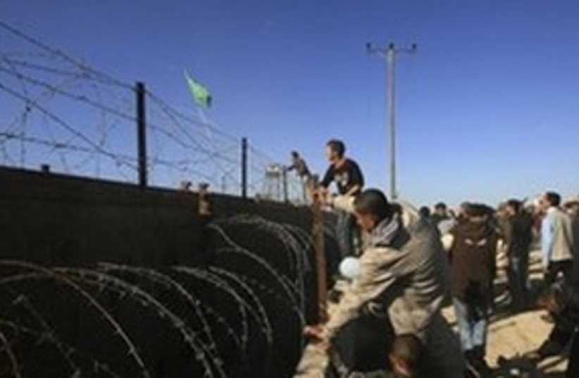 Palestinian Hamas supporters throw stones  (photo credit: AP)