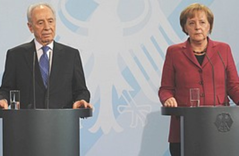 Merkel Peres  (photo credit: GPO/Amos Ben-Gershom )