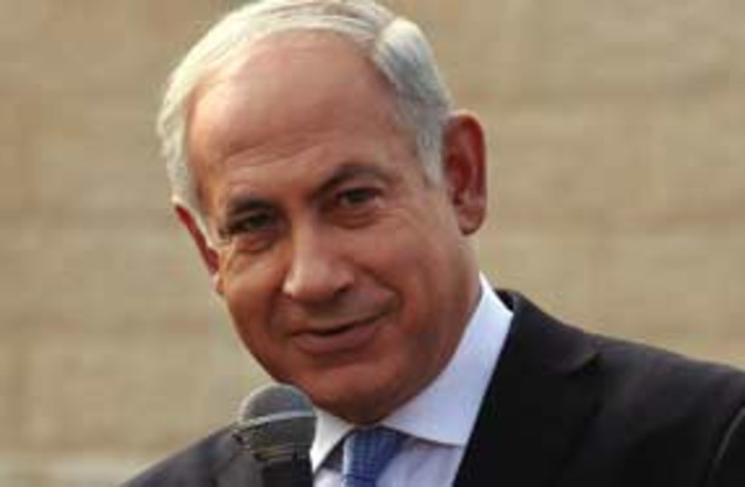 Bibi smiling and pointing 311 ap (photo credit: Associated Press)