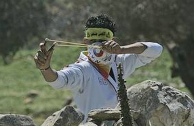 iraq burin youth stones palestinian 311 (photo credit: AP)