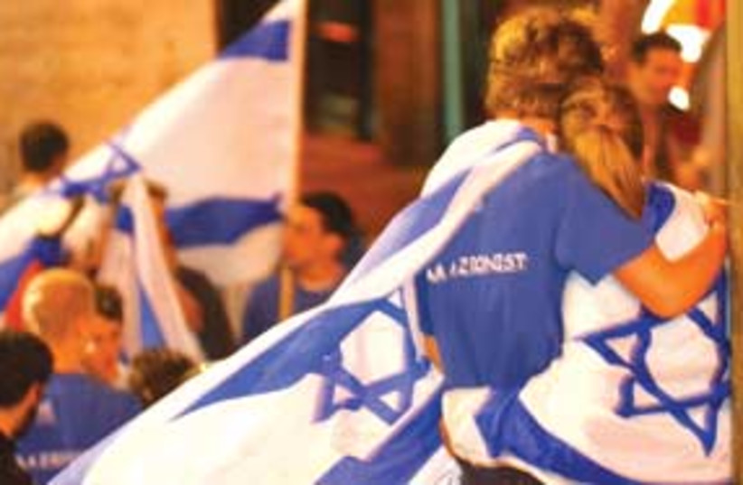 israel flag draped 311 (photo credit: Ariel Jerozolimski)