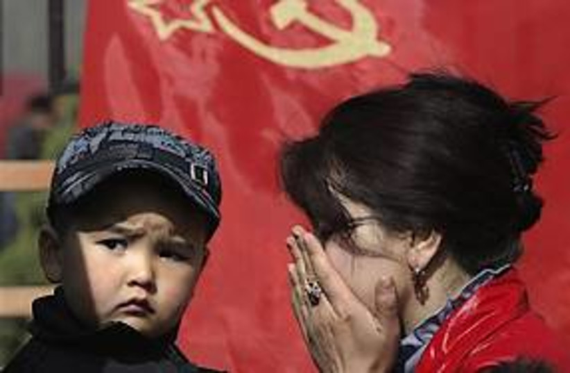 kyrgyz woman mourns 311 (photo credit: AP)