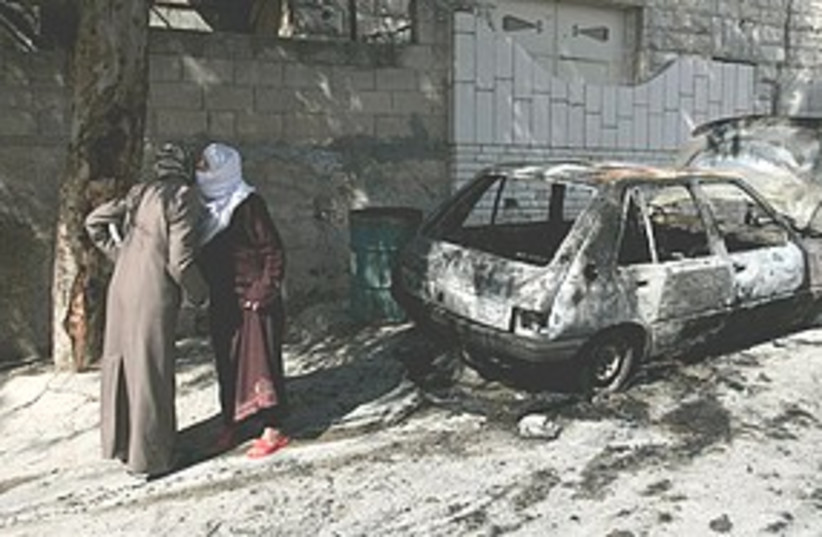 Torched car in West Bank 311 (photo credit: Associated Press)
