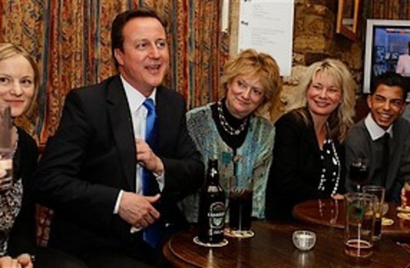Cameron in pub 311 (photo credit: Associated Press)
