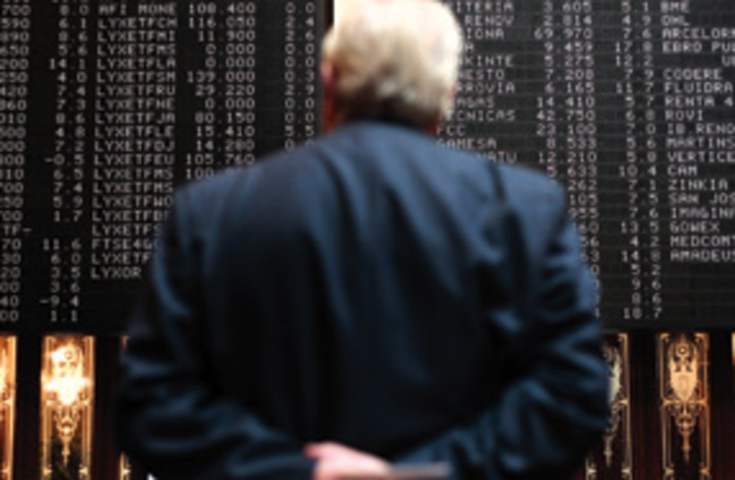 Trader watches the stocks 311 (photo credit: AP)