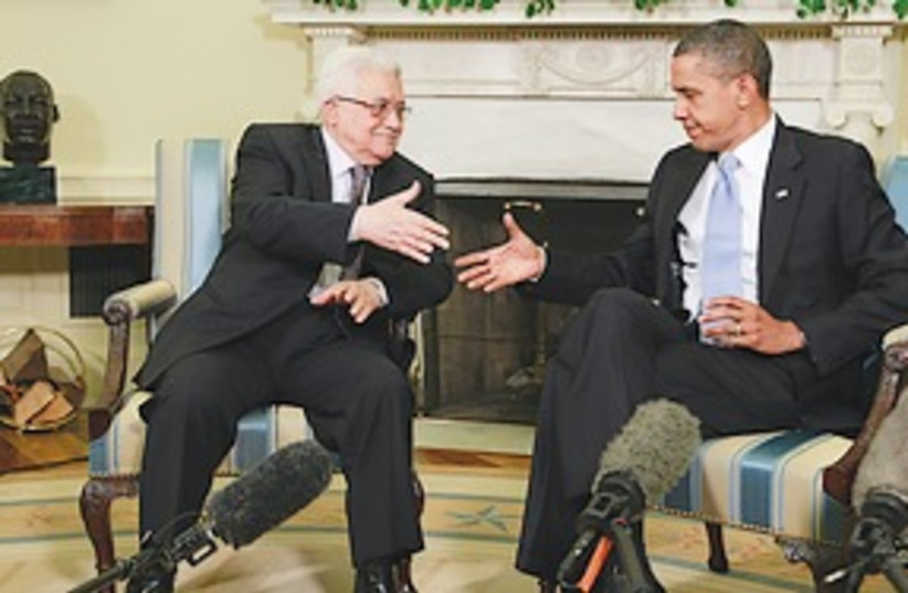 Obama, Abbas shake hands 311 (photo credit: Associated Press)