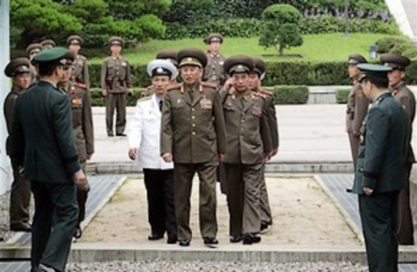 north Korea officers 298 (photo credit: AP)