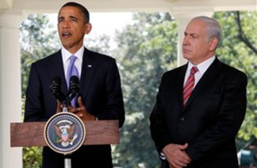 Obama speaks as Bibi looks on 311 (photo credit: Associated Press)