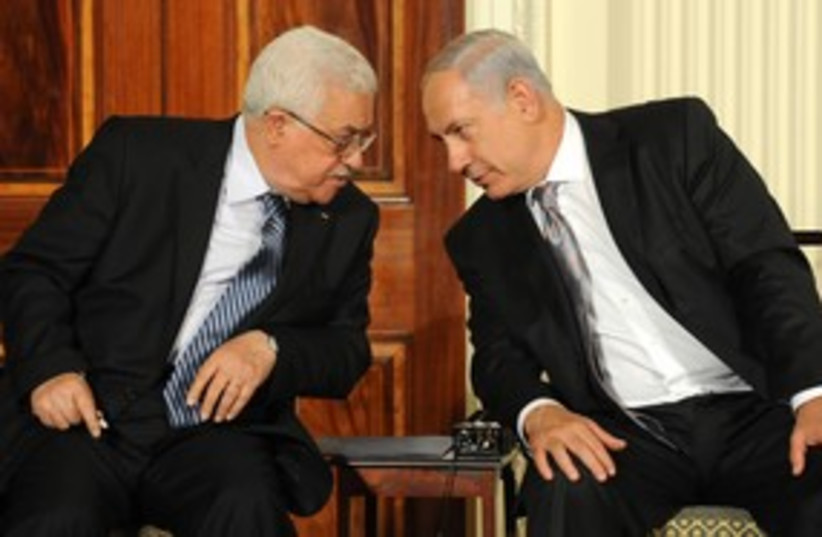 311_Abbas stares down Netanyahu (photo credit: Associated Press)