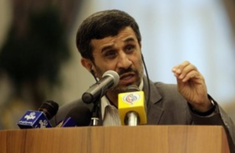 Ahmadinejad speaking to press, squinting 311 (photo credit: AP Photo/Osama Faisal)