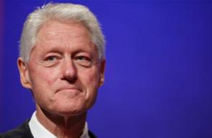 Bill Clinton kind of smiling 311 (photo credit: AP Photo/Mark Lennihan)
