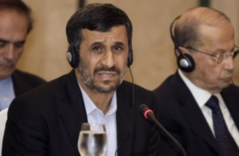 Ahmadinejad cool headphones 311 AP (photo credit: Associated Press)