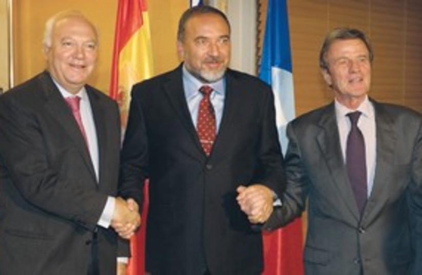 Lieberman holding hands with Kouchner & Moratinos 311 AP (photo credit: AP)