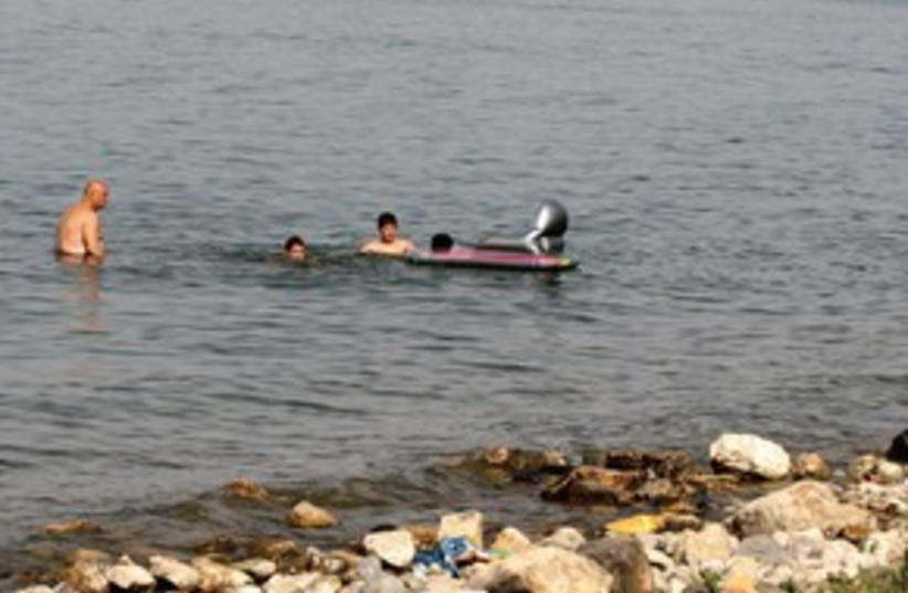 people swimming in Kinneret 311 (photo credit: Ariel Jerozolimski)