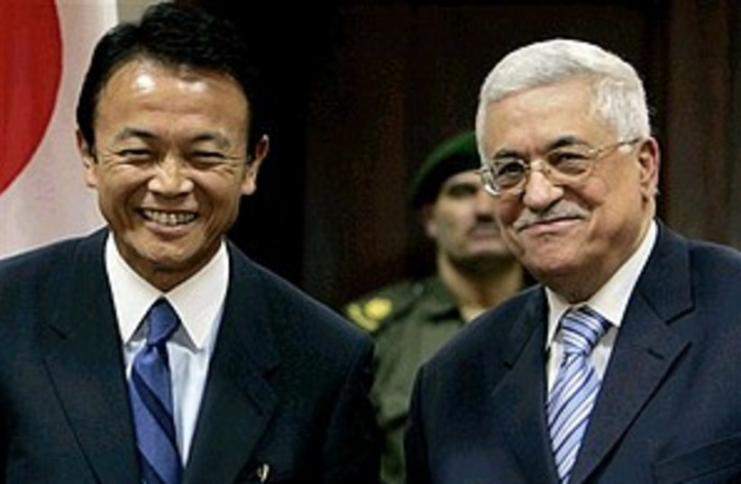 abbas and japanese fm 29 (photo credit: AP)