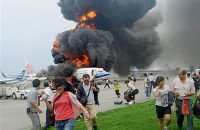 japan jet blast 298.88 (photo credit: AP)
