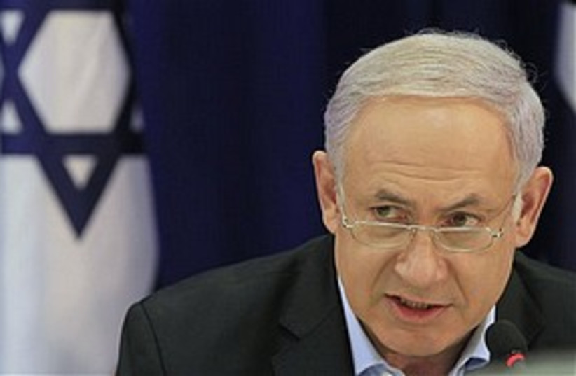 Netanyahu serious with flag 311 ap (photo credit: Associated Press)