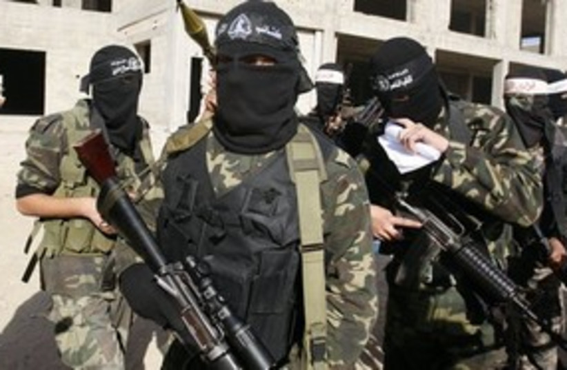 Hamas masks news conference Gaza 311 (photo credit: AP)