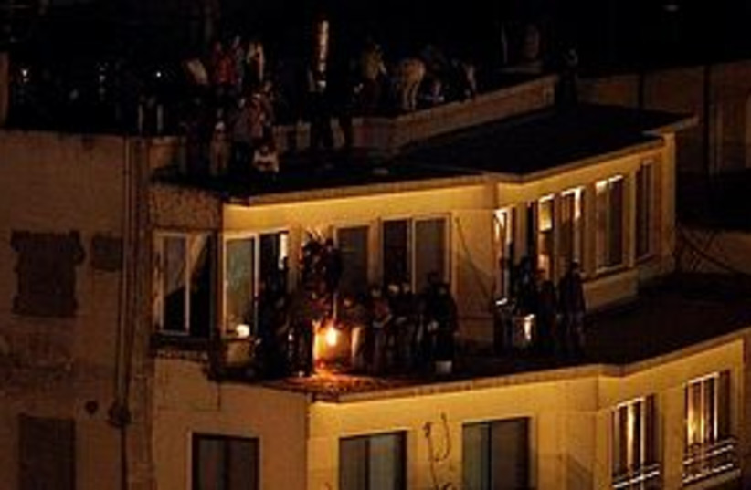 egypt protest rooftop night firebomb 311 (photo credit: AP)