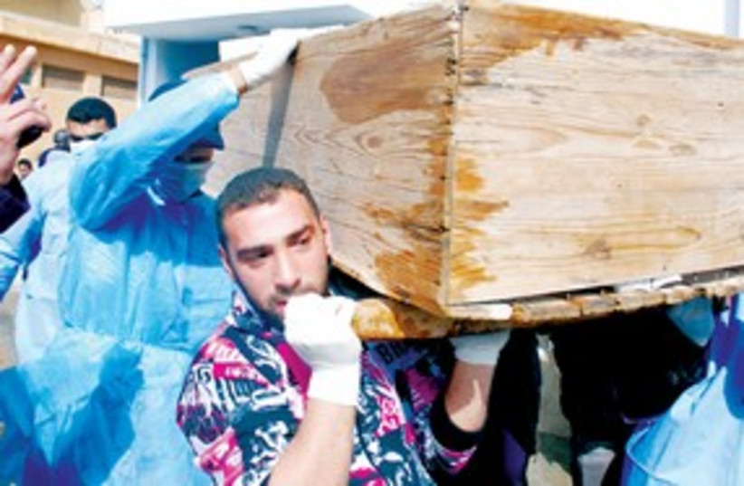 Men carry coffin Libya 311 (photo credit: ASSOCIATED PRESS)