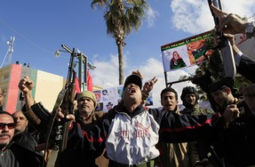 Libyan anti-Gaddafi protests (R) 311 (photo credit: REUTERS/Ahmed Jadallah)
